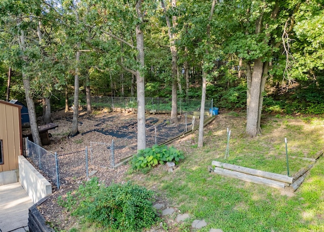 view of yard with a garden and fence