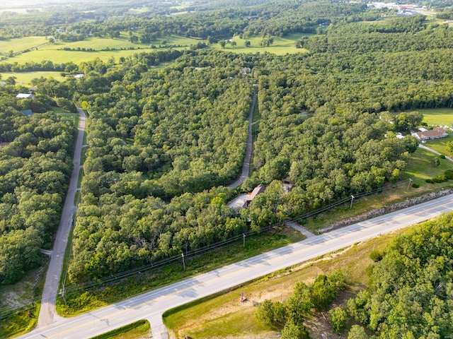 drone / aerial view featuring a view of trees