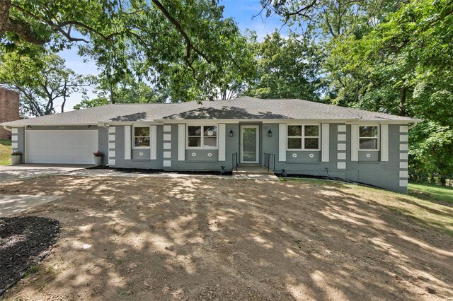 ranch-style house featuring a garage