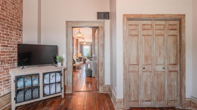 corridor with dark wood-type flooring