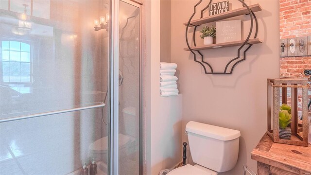 bathroom featuring walk in shower and toilet