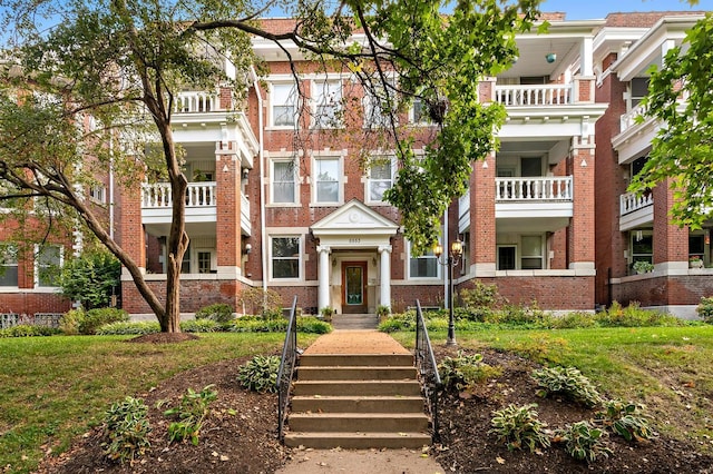 view of front of house with brick siding