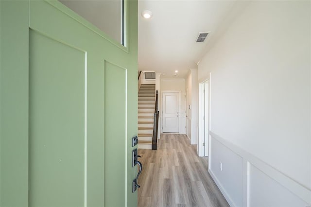 hall with light hardwood / wood-style flooring