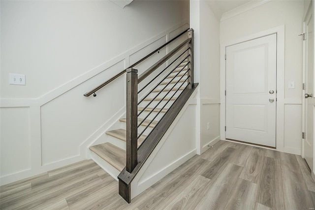 stairs with wood-type flooring