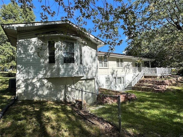 view of property exterior with a lawn