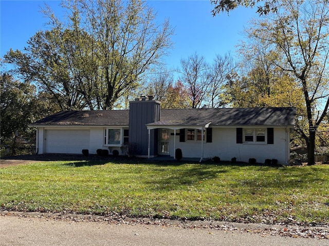 ranch-style house featuring a garage and a front yard