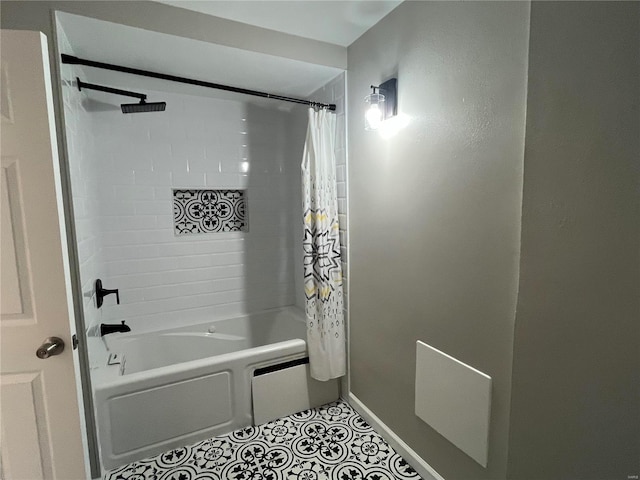 bathroom featuring shower / bath combo and tile patterned flooring