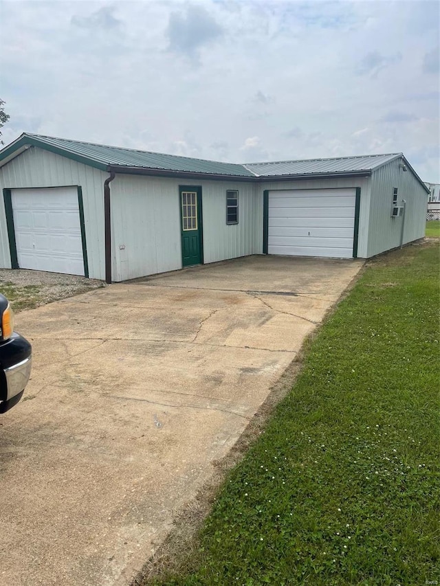 garage with a lawn