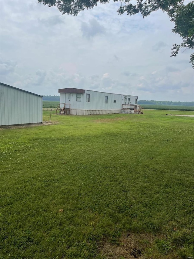 view of yard with a rural view