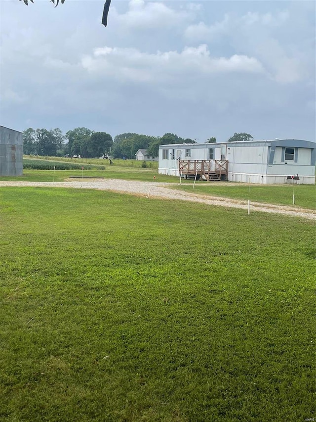 view of home's community featuring a deck and a lawn