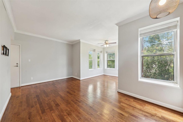 unfurnished living room featuring a ceiling fan, baseboards, ornamental molding, and wood finished floors