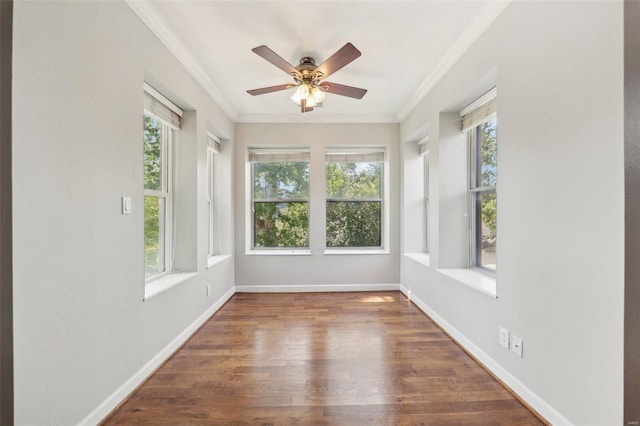 unfurnished sunroom featuring a ceiling fan