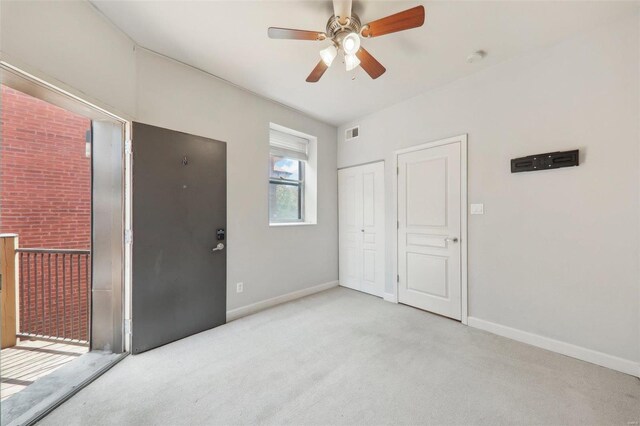 unfurnished bedroom with light colored carpet, ceiling fan, visible vents, and baseboards