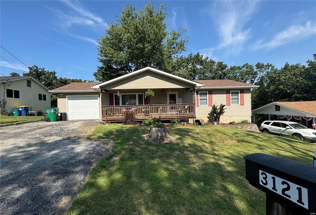 view of front of house with a garage and a front lawn