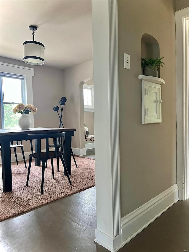 dining area with concrete flooring and a wealth of natural light