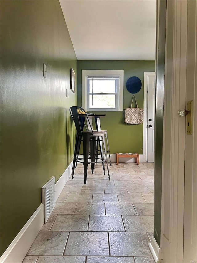 interior space with light tile patterned floors