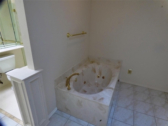 bathroom featuring tile patterned flooring and a bathtub