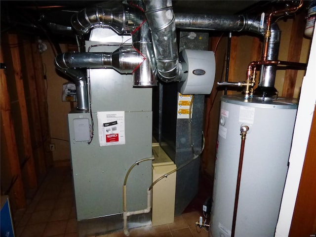 utility room featuring water heater