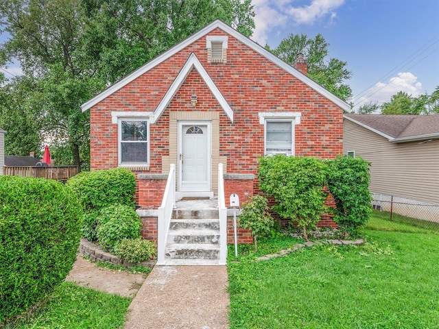 bungalow with a front lawn