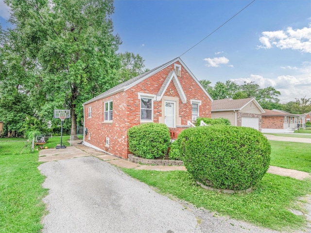 view of front of home with a garage and a front yard