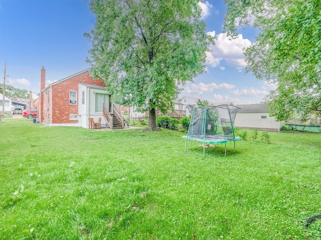 view of yard with a trampoline