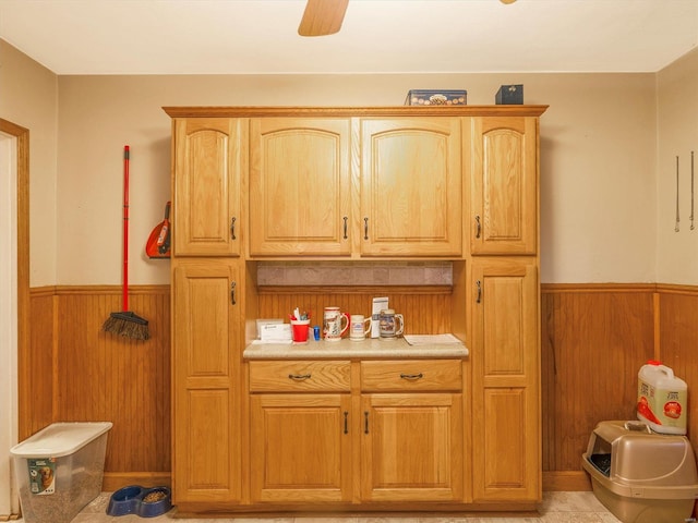 kitchen featuring light tile patterned floors and ceiling fan