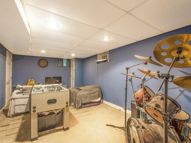 carpeted bedroom featuring a paneled ceiling