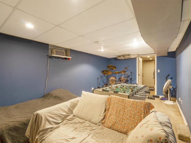 bedroom with a paneled ceiling and carpet