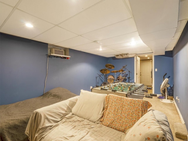 carpeted bedroom featuring a paneled ceiling