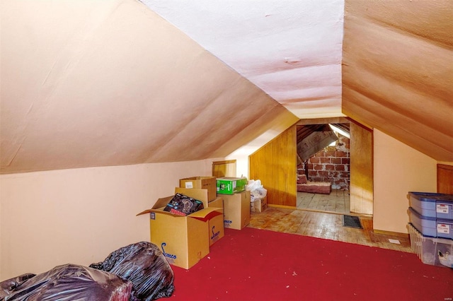 interior space featuring vaulted ceiling and hardwood / wood-style floors