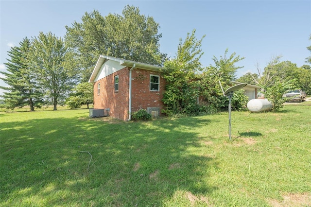 view of yard featuring central AC unit