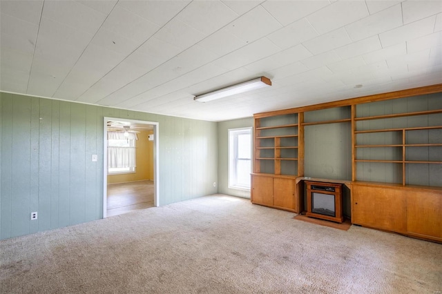 spare room featuring light carpet