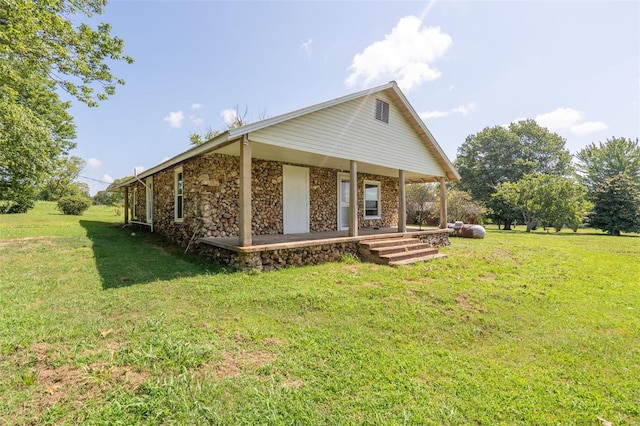 exterior space featuring a front lawn and a porch