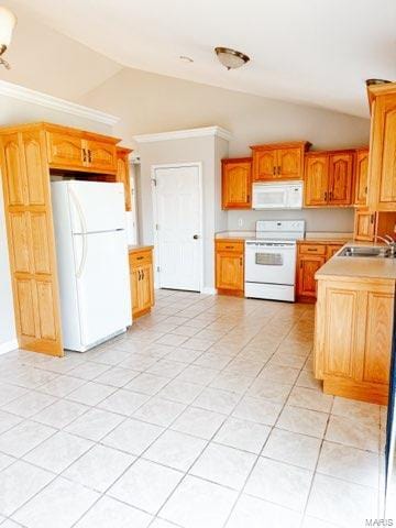 kitchen featuring light tile patterned flooring, lofted ceiling, white appliances, and sink