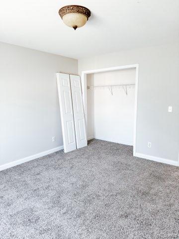 unfurnished bedroom featuring carpet flooring