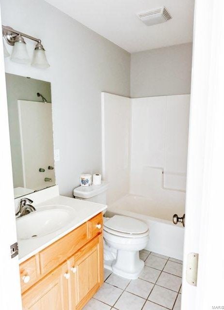 full bathroom featuring vanity, shower / bath combination, tile patterned flooring, and toilet