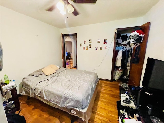 bedroom with hardwood / wood-style floors and ceiling fan