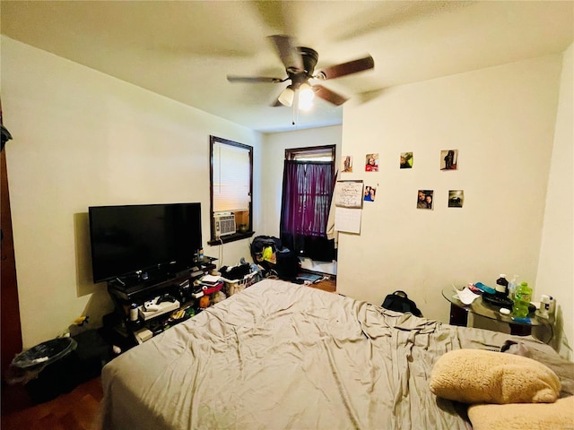 bedroom featuring ceiling fan and cooling unit