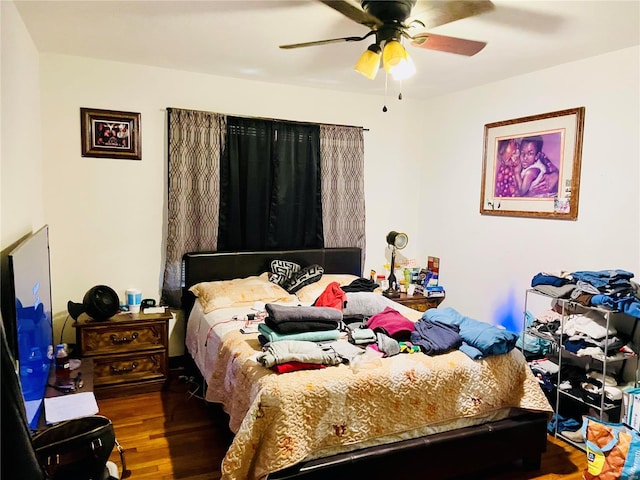 bedroom featuring ceiling fan and wood-type flooring