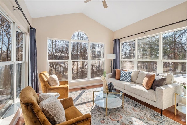 sunroom featuring ceiling fan and vaulted ceiling