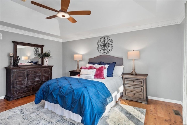 bedroom featuring crown molding, ceiling fan, lofted ceiling, and light hardwood / wood-style floors