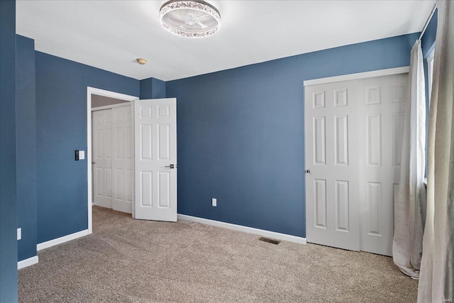 unfurnished bedroom featuring carpet