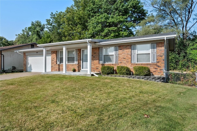 single story home featuring a front yard and a garage