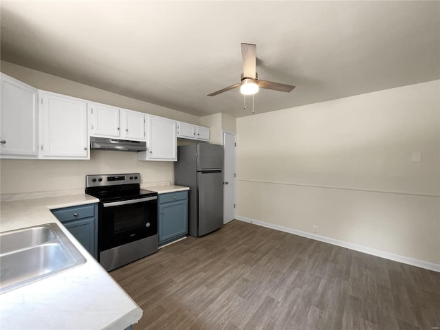 kitchen with white cabinets, appliances with stainless steel finishes, sink, and dark hardwood / wood-style floors