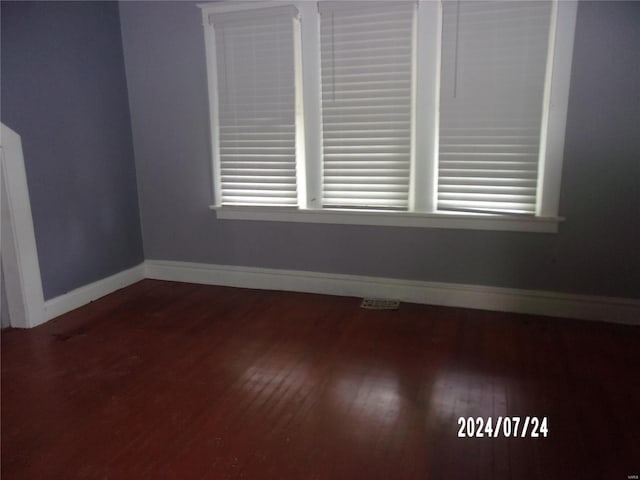 empty room featuring wood-type flooring