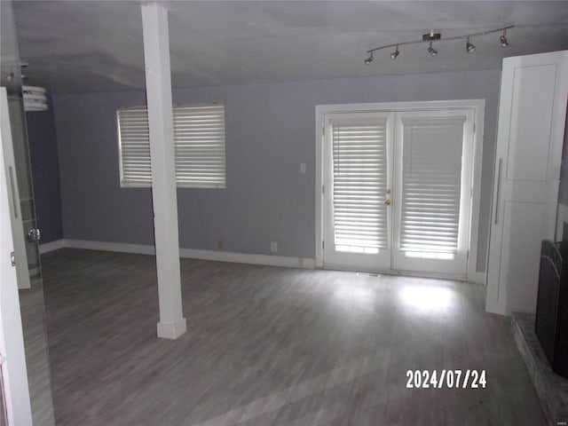 interior space featuring wood-type flooring and rail lighting