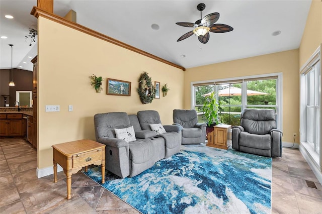 tiled living room with ceiling fan and vaulted ceiling