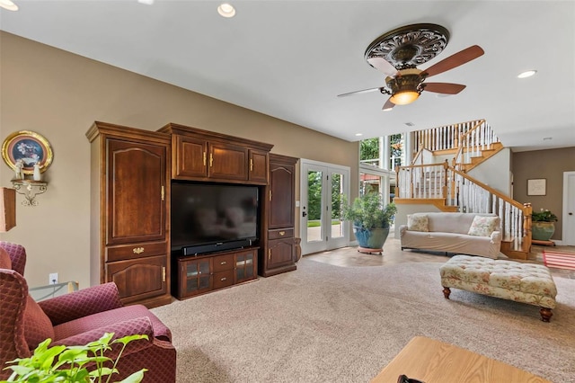 living room with french doors, carpet floors, and ceiling fan