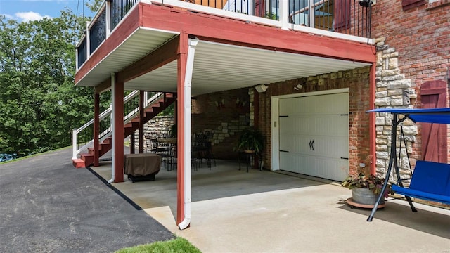 view of patio featuring a garage