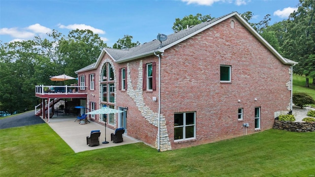 exterior space featuring a lawn and a patio area